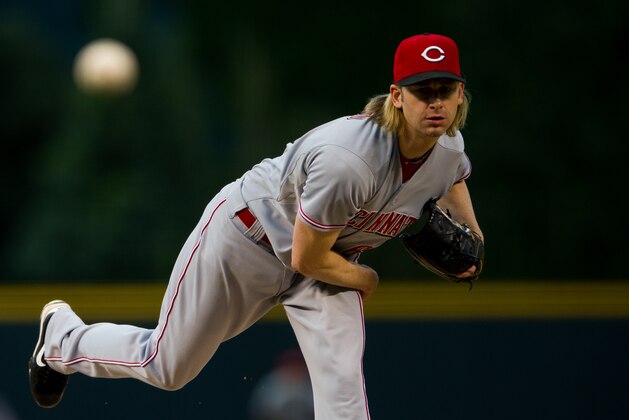 DENVER, CO - AUGUST 30:  Bronson Arroyo #61 of the Cincinnati Reds throws a pitch against the Colorado Rockies during the first inning of a game at Coors Field on August 30, 2013 in Denver, Colorado. (Photo by Dustin Bradford/Getty Images)