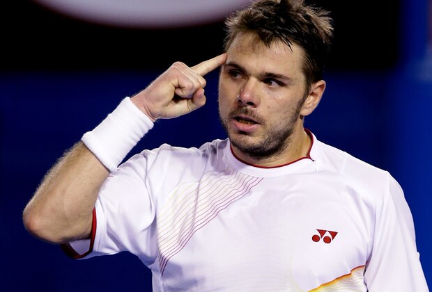 Stanislas Wawrinka of Switzerland celebrates a point won against Rafael Nadal of Spain in the men's singles final at the Australian Open tennis championship in Melbourne, Australia, Sunday, Jan. 26, 2014.  (AP Photo/Aaron Favila)