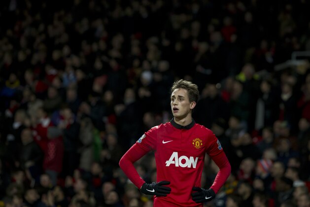 Manchester United's Adnan Januzaj waits to take a free kick during his team's English Premier League soccer match against Swansea City at Old Trafford Stadium, Manchester, England, Saturday Jan. 11, 2014. (AP Photo/Jon Super)