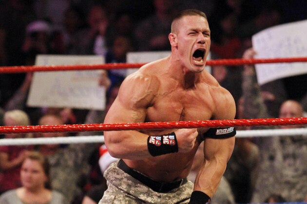 John Cena, right, and Mark Henry perform during WWE’s 9th annual