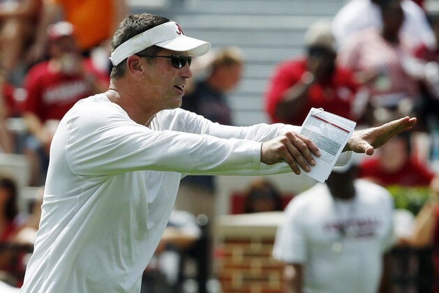 FILE - In this Aug. 5, 2012, file photo, Alabama offensive coordinator Doug Nussmeier instructs players during a practice at their NCAA college football fan day in Tuscaloosa, Ala. University trustees on Tuesday, April 16, 2013, announced that Nussmeier would receive a $90,000 raise to $680,000. Like defensive coordinator Kirby Smart, he has a three-year deal running through Feb. 28, 2016. (AP Photo/Butch Dill)