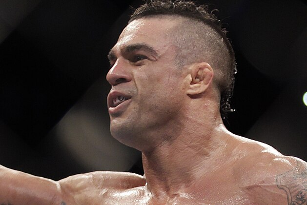 Vitor Belfort, from Brazil, celebrates after defeating Michael Bisping, from Britain during their  middleweight mixed martial arts bout at the Ultimate Fighting Championship (UFC) in Sao Paulo, Brazil, Sunday, Jan. 20, 2013. (AP Photo/Andre Penner)