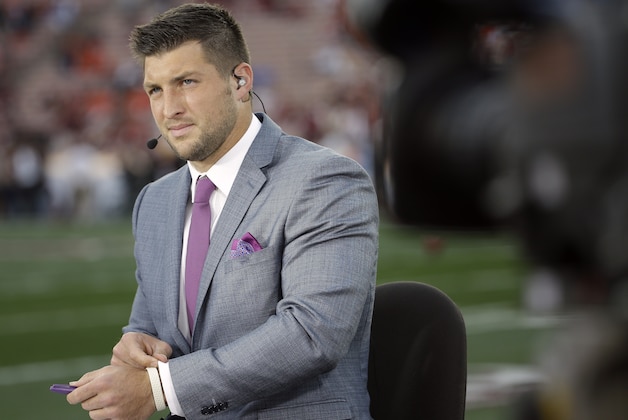 Tim Tebow speaks on ESPN before the NCAA BCS National Championship college football game between Auburn and Florida State Monday, Jan. 6, 2014, in Pasadena, Calif. (AP Photo/David J. Phillip)