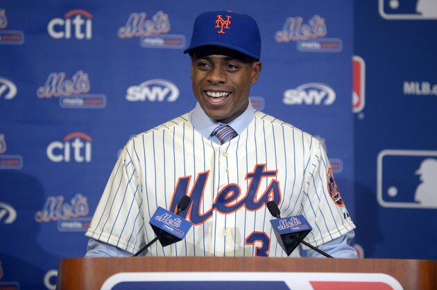 New York Mets outfielder Curtis Granderson answers a question during a news conference announcing his signing at baseball's winter meetings in Lake Buena Vista, Fla., Tuesday, Dec. 10, 2013.(AP Photo/Phelan M. Ebenhack) New York Mets outfielder Curtis Granderson answers a question during a news conference announcing his signing at baseball's winter meetings in Lake Buena Vista, Fla., Tuesday, Dec. 10, 2013.(AP Photo/Phelan M. Ebenhack)