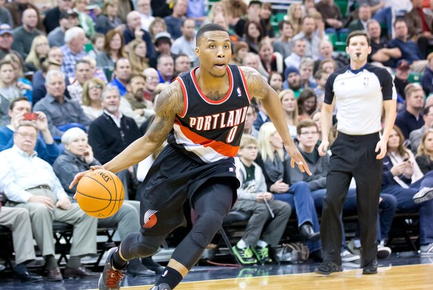 Dec 9, 2013; Salt Lake City, UT, USA; Portland Trail Blazers point guard Damian Lillard (0) dribbles toward the basket during the first half against the Utah Jazz at EnergySolutions Arena. Mandatory Credit: Russ Isabella-USA TODAY Sports Dec 9, 2013; Salt Lake City, UT, USA; Portland Trail Blazers point guard Damian Lillard (0) dribbles toward the basket during the first half against the Utah Jazz at EnergySolutions Arena. Mandatory Credit: Russ Isabella-USA TODAY Sports