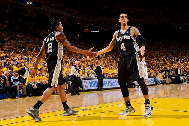 OAKLAND, CA - MAY 16: Kawhi Leonard #2 and Danny Green #4 of the San Antonio Spurs celebrate while playing the Golden State Warriors in Game Six of the Western Conference Semifinals during the 2013 NBA Playoffs on May 16, 2013 at Oracle Arena in Oakland, California.  NOTE TO USER: User expressly acknowledges and agrees that, by downloading and or using this photograph, User is consenting to the terms and conditions of the Getty Images License Agreement. Mandatory Copyright Notice: Copyright 2013 NBAE  (Photo by Andrew D. Bernstein/NBAE via Getty Images)