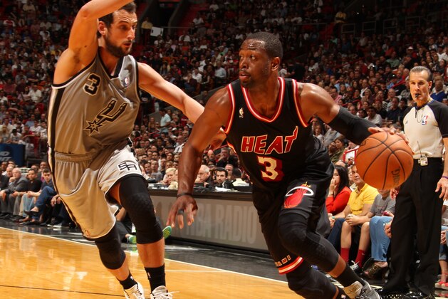 MIAMI, FL - JANUARY 26: Dwyane Wade #3 of the Miami Heat dribbles the ball against the San Antonio Spurs at the American Airlines Arena in Miami, Florida on Jan. 26, 2014. NOTE TO USER: User expressly acknowledges and agrees that, by downloading and/or using this photograph, user is consenting to the terms and conditions of the Getty Images License Agreement. Mandatory copyright notice: Copyright NBAE 2014 (Photo by Issac Baldizon/NBAE via Getty Images)