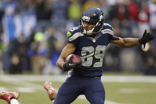 Seattle Seahawks' Doug Baldwin (89) runs a ball against the San Francisco 49ers during the first half of the NFL football NFC Championship game Sunday, Jan. 19, 2014, in Seattle. (AP Photo/Elaine Thompson)