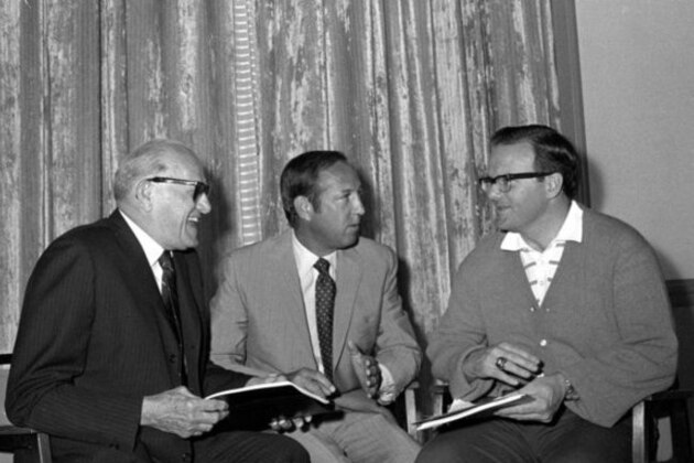 The annual meeting of the National Football League opened March 22, 1971 in Palm Beach, Fla., after a preliminary huddle between George Halas, of Chicago, left, president of the National Concerence; Pete Rozelle, NFL commissioner, and Lamar Hunt, right, of Kansas City, president of the American Football League Conference. (AP photo)