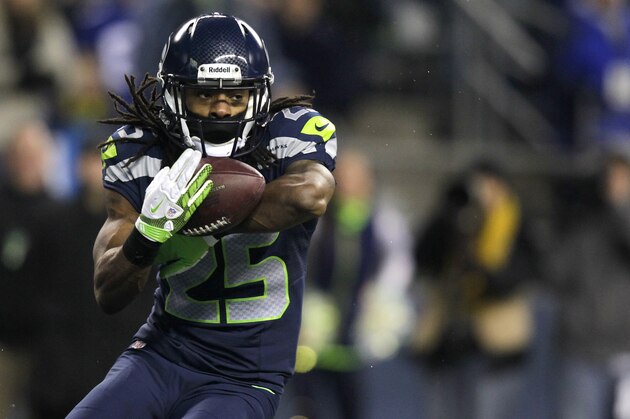 Seattle Seahawks' Richard Sherman intercepts a pass from St. Louis Rams quarterback Sam Bradford in the second half of an NFL football game, Sunday, Dec. 30, 2012, in Seattle. The Seahawks defeated the Rams 20-13. (AP Photo/Stephen Brashear)
