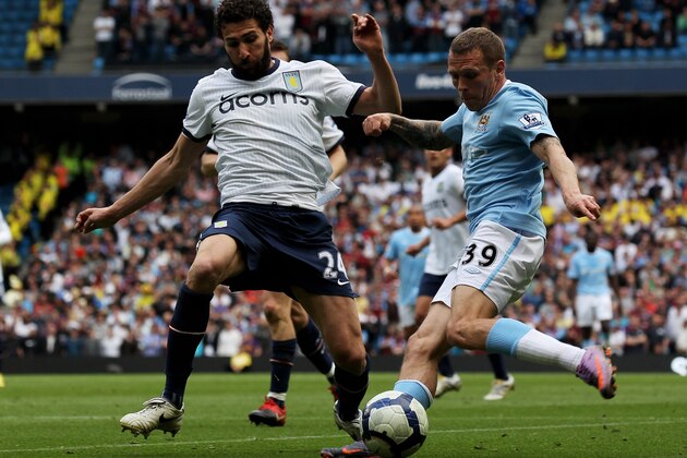 MANCHESTER, ENGLAND - MAY 01:  Craig Bellamy of Manchester City attempts to cross the ball past Carlos Cuellar of Aston Villa during the Barclays Premier League match between Manchester City and Aston Villa at the City of Manchester Stadium on May 1, 2010 in Manchester, England.  (Photo by Alex Livesey/Getty Images)