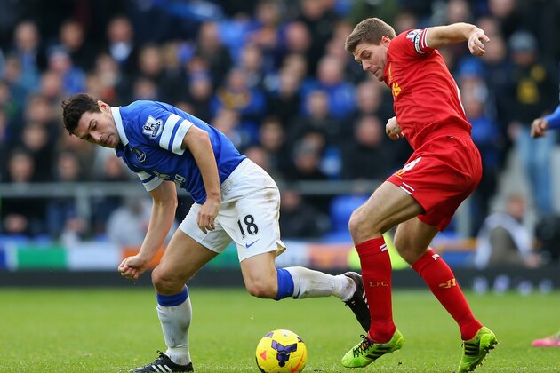 LIVERPOOL, ENGLAND - NOVEMBER 23: Steven Gerrard of Liverpool tangles with Gareth Barry of Everton during the Barclays Premier League match between Everton and Liverpool at Goodison Park on November 23, 2013 in Liverpool, England. (Photo by Alex Livesey/Getty Images) LIVERPOOL, ENGLAND - NOVEMBER 23: Steven Gerrard of Liverpool tangles with Gareth Barry of Everton during the Barclays Premier League match between Everton and Liverpool at Goodison Park on November 23, 2013 in Liverpool, England. (Photo by Alex Livesey/Getty Images)