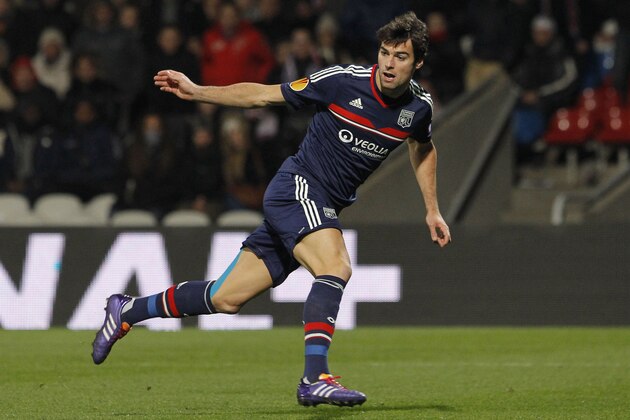 FILE - In this Nov. 28, 2013 file photo, Lyon's Yoann Gourcuff looks on after kicking the ball during their Europa League soccer match against Real Betis in Lyon, central France. The 27-year-old with 31 caps hit rock bottom when a handful of fans watched him play for Lyon's reserves in early November. It was Gourcuff’s latest comeback from injury, yet his improved recent form suggests the elegant playmaker whose shoulders were crushed by the weight of expectation could now be turning the corner. (AP Photo/Laurent Cipriani, File)
