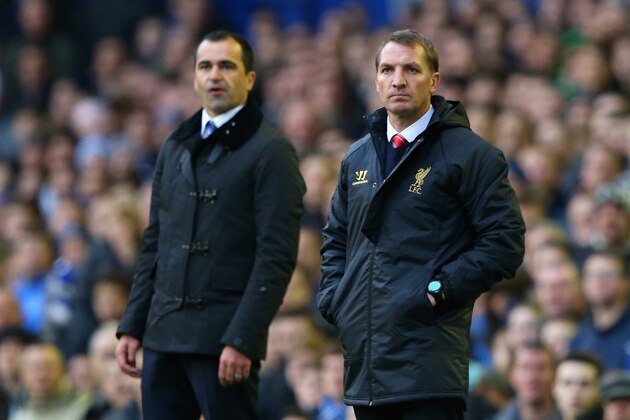 LIVERPOOL, ENGLAND - NOVEMBER 23:  Liverpool Manager Brendan Rodgers (R) and Everton Manager Roberto Martinez look on during the Barclays Premier League match between Everton and Liverpool at Goodison Park on November 23, 2013 in Liverpool, England.  (Photo by Alex Livesey/Getty Images)