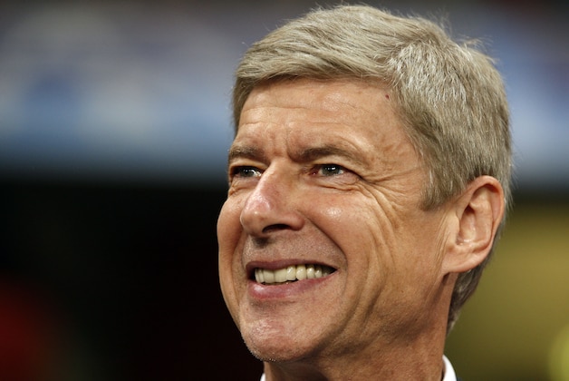 Arsenal's manager Arsene Wenger smiles ahead of their Champions League group H match against Braga at the Emirates Stadium, London, Wednesday, Sept 15, 2010.  (AP Photo/Kirsty Wigglesworth)