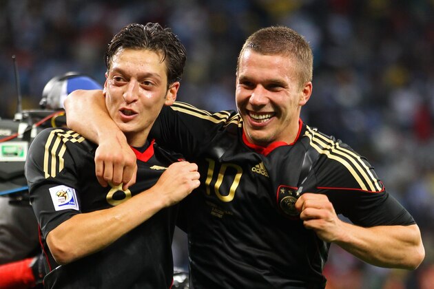 CAPE TOWN, SOUTH AFRICA - JULY 03:  Mesut Oezil and Lukas Podolski of Germany celebrate victory following the 2010 FIFA World Cup South Africa Quarter Final match between Argentina and Germany at Green Point Stadium on July 3, 2010 in Cape Town, South Africa.  (Photo by Joern Pollex/Getty Images)