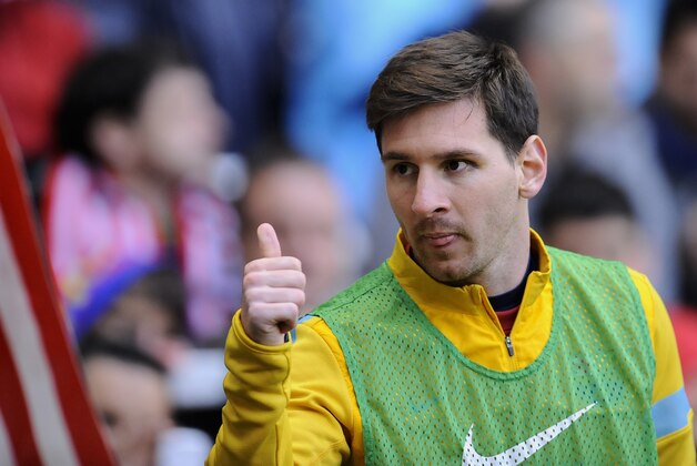 FC Barcelona's Lionel Messi from Argentina, gestures to his fans before the match against  Athletic Bilbao during their Spanish League soccer match, at San Mames stadium in Bilbao, northern Spain, Saturday, April 27, 2013. (AP Photo/Alvaro Barrientos)