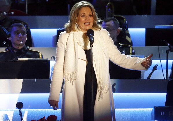 FILE - This Dec. 6, 2013 file photo shows Renee Fleming performing at the National Christmas Tree lighting ceremony across from the White House in Washington. Fleming, a four-time Grammy winner, will perform sing the national anthem before the Denver Broncos take on the Seattle Seahawks at MetLife Stadium in East Rutherford, N.J. on Feb 2. (AP Photo/Charles Dharapak, File)