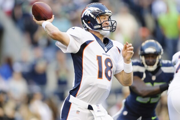 Aug 17, 2013; Seattle, WA, USA; Denver Broncos quarterback Peyton Manning (18) passes the ball during the 1st half against the Seattle Seahawks at CenturyLink Field. Mandatory Credit: Steven Bisig-USA TODAY Sports