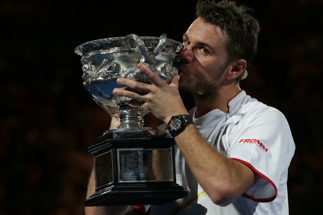 Stanislas Wawrinka of Switzerland kisses the trophy after defeating Rafael Nadal of Spain in the men's singles final at the Australian Open tennis championship in Melbourne, Australia, Sunday, Jan. 26, 2014. (AP Photo/Aaron Favila) Stanislas Wawrinka of Switzerland kisses the trophy after defeating Rafael Nadal of Spain in the men's singles final at the Australian Open tennis championship in Melbourne, Australia, Sunday, Jan. 26, 2014. (AP Photo/Aaron Favila)