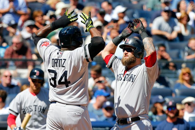 NEW YORK, NY - SEPTEMBER 07:  Mike Napoli #12 of the Boston Red Sox celebrates his second inning two run home run against the New York Yankees with teammate David Ortiz #34 at Yankee Stadium on September 7, 2013 in the Bronx borough of New York City.  (Photo by Jim McIsaac/Getty Images)
