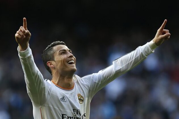 Real Madrid's Cristiano Ronaldo from Portugal celebrates his goal during a Spanish La Liga soccer match between Real Madrid and Granada at the Santiago Bernabeu stadium in Madrid, Spain, Saturday, Jan. 25, 2014. (AP Photo/Andres Kudacki)