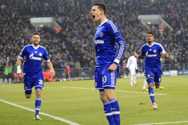 Schalke's Julian Draxler celebrates after scoring his side's opening goal during the Champions League group E soccer match between FC Schalke 04 and FC Basel in Gelsenkirchen, Germany, Wednesday, Dec.11,2013. (AP Photo/Frank Augstein)