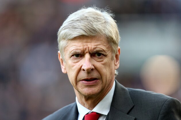 Arsenal's manager Arsene Wenger looks on ahead of their English Premier League soccer match against Newcastle United at St James' Park, Newcastle, England, Sunday, Dec. 29, 2013. (AP Photo/Scott Heppell)