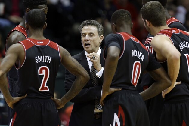 Louisville head coach Rick Pitino talks to his team during the first half of an NCAA college basketball game against South Florida Wednesday, Jan. 22, 2014, in Tampa, Fla. Louisville won the game 86-47. (AP Photo/Chris O'Meara)