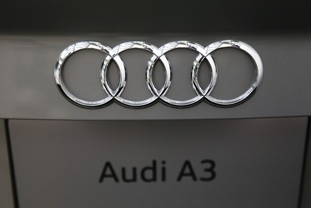 The Audi logo is seen on the new 2015 A3 sedan at the Los Angeles Auto Show on Tuesday, Nov. 19, 2013, in Los Angeles. The auto show opens to public on Friday, Nov. 22. (AP Photo/Jae C. Hong)