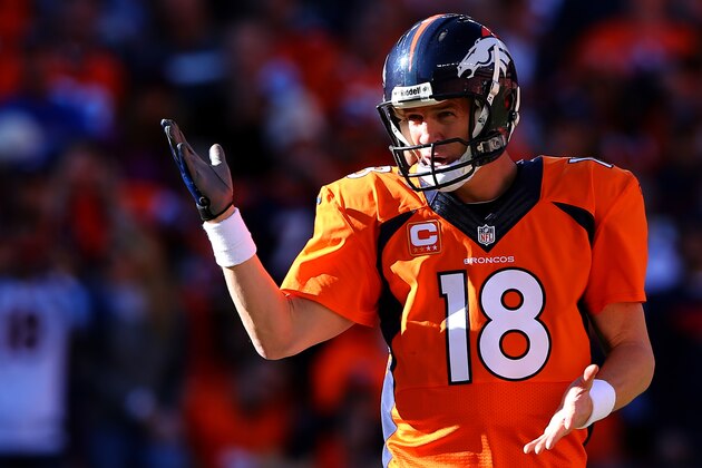DENVER, CO - JANUARY 19:  Peyton Manning #18 of the Denver Broncos in action against the New England Patriots during the AFC Championship game at Sports Authority Field at Mile High on January 19, 2014 in Denver, Colorado.  (Photo by Elsa/Getty Images)