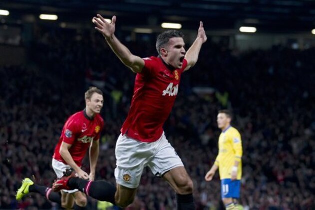 Manchester United's Robin van Persie celebrates after scoring against Arsenal during their English Premier League soccer match at Old Trafford Stadium, Manchester, England, Saturday Nov. 10, 2013. (AP Photo/Jon Super)