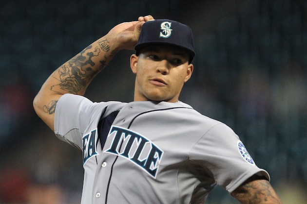 HOUSTON, TX - AUGUST 30:  Taijuan Walker #27 of the Seattle Mariners throws in the first inning against the Houston Astros at Minute Maid Park on August 30, 2013 in Houston, Texas.  (Photo by Bob Levey/Getty Images)