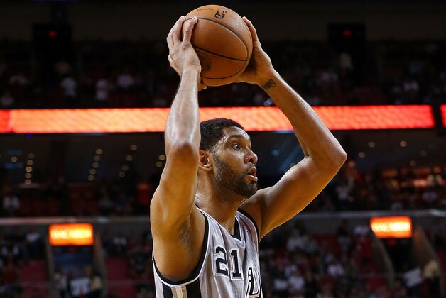 MIAMI, FL - JANUARY 26: Tim Duncan #21 of the San Antonio Spurs looks to pass during a game against the Miami Heat at American Airlines Arena on January 26, 2014 in Miami, Florida. NOTE TO USER: User expressly acknowledges and agrees that, by downloading and/or using this photograph, user is consenting to the terms and conditions of the Getty Images License Agreement. Mandatory copyright notice:  (Photo by Mike Ehrmann/Getty Images)