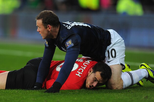 CARDIFF, WALES - NOVEMBER 24: Manchester United player Wayne Rooney (r) clashes with Jordon Mutch for a challenge which Rooney is booked during the Barclays Premier League match between Cardiff City and Manchester United at Cardiff City Stadium on November 24, 2013 in Cardiff, Wales. (Photo by Stu Forster/Getty Images) CARDIFF, WALES - NOVEMBER 24: Manchester United player Wayne Rooney (r) clashes with Jordon Mutch for a challenge which Rooney is booked during the Barclays Premier League match between Cardiff City and Manchester United at Cardiff City Stadium on November 24, 2013 in Cardiff, Wales. (Photo by Stu Forster/Getty Images)