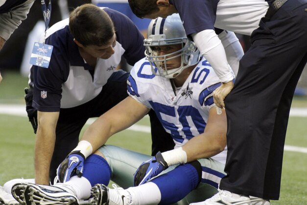 Dallas Cowboys linebacker Sean Lee is attended to after suffering a concussion against the Washington Redskins during the first half of an NFL football game, Sunday, Dec. 19, 2010 in Arlington, Texas. (AP Photo/Sharon Ellman)