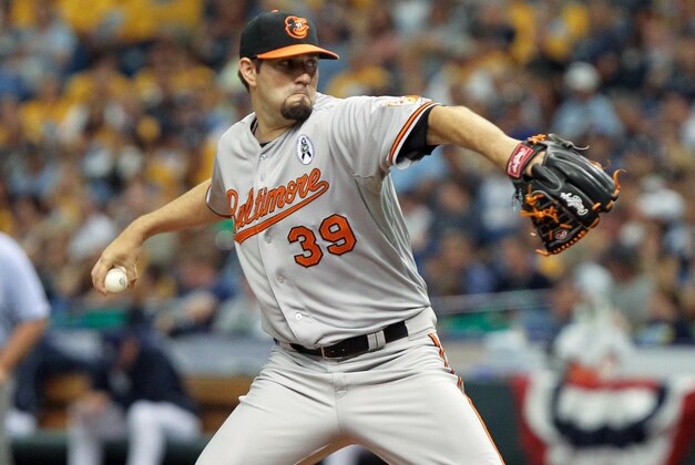 April 2, 2012; St. Petersburg, FL, USA; Baltimore Orioles starting pitcher Jason Hammel (39) throws a pitch during the fourth inning against the Tampa Bay Rays during opening day at Tropicana Field. Mandatory Credit: Kim Klement-USA TODAY Sports