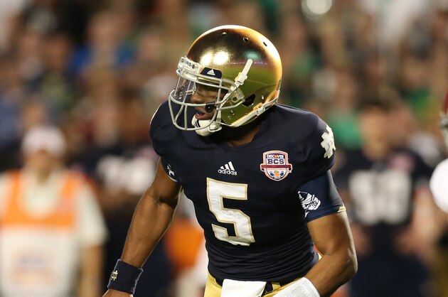 Jan 7, 2013; Miami, FL, USA; Notre Dame Fighting Irish quarterback Everett Golson (5) scrambles against the Alabama Crimson Tide during the 2013 BCS Championship game at Sun Life Stadium. Alabama won 42-14.  Mandatory Credit: Matthew Emmons-USA TODAY Sports