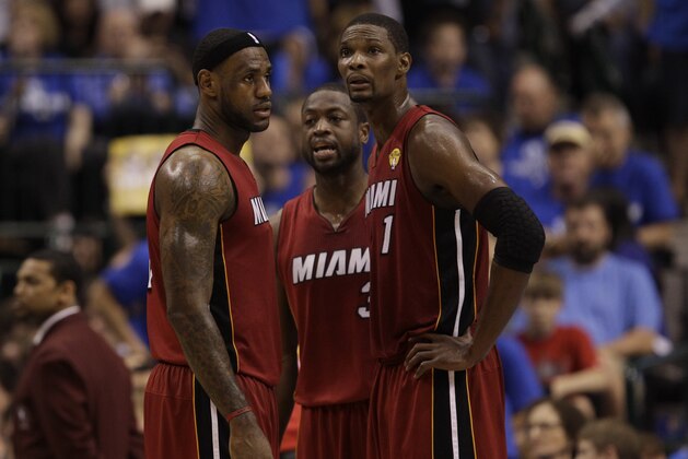 Miami Heat's LeBron James, Chris Bosh and Dwyane Wade are seen during the first half of Game 4 of the NBA Finals basketball game against the Dallas Mavericks Tuesday, June 7, 2011, in Dallas. (AP Photo/David J. Phillip)