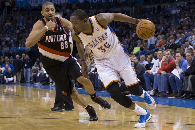 OKLAHOMA CITY, OK - January 21, 2014 : Kevin Durant #35 of the Oklahoma City Thunder handling the ball during a game against the Portland Trail Blazers at the Chesapeake Arena on January 21, 2014 in Oklahoma City, Oklahoma. NOTE TO USER: User expressly acknowledges and agrees that, by downloading and/or using this photograph, user is consenting to the terms and conditions of the Getty Images License Agreement. Mandatory Copyright Notice: Copyright 2014 NBAE (Photo by Richard Rowe/NBAE via Getty Images) OKLAHOMA CITY, OK - January 21, 2014 : Kevin Durant #35 of the Oklahoma City Thunder handling the ball during a game against the Portland Trail Blazers at the Chesapeake Arena on January 21, 2014 in Oklahoma City, Oklahoma. NOTE TO USER: User expressly acknowledges and agrees that, by downloading and/or using this photograph, user is consenting to the terms and conditions of the Getty Images License Agreement. Mandatory Copyright Notice: Copyright 2014 NBAE (Photo by Richard Rowe/NBAE via Getty Images)