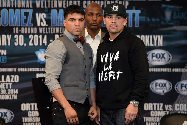 Dec 7, 2013; Brooklyn, NY, USA; American boxing champion and promoter Bernard Hopkins (center) looks on as Vicious Victor Ortiz (left) and Luis Collazo (right) pose for a photo to promote their bout at Barclays Center. Mandatory Credit: Joe Camporeale-USA TODAY Sports