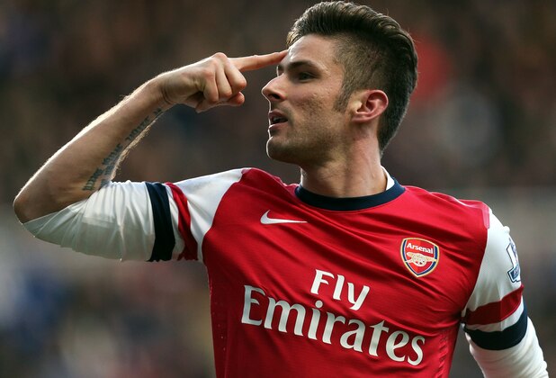 Arsenal's Olivier Giroud celebrates his goal during their English Premier League soccer match against Newcastle United at St James' Park, Newcastle, England, Sunday, Dec. 29, 2013. (AP Photo/Scott Heppell)