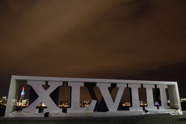 Roman numerals for NFL Super Bowl XLVIII football game are erected, Monday, Jan. 27, 2014, at Pier A Park in Hoboken, N.J., with the New York City skyline, including the Empire State Building, far left. A concert and fireworks show at Liberty State Park in Jersey City, N.J., kicked off the week festivities leading to Sunday's game. The Seattle Seahawks and the Denver Broncos are scheduled to play on Sunday, Feb. 2, 2014, at MetLife Stadium in East Rutherford, N.J. (AP Photo/Julio Cortez)