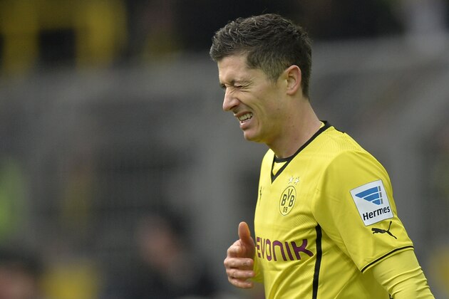 Dortmund's Robert Lewandowski of Poland is unhappy after missing to score during the German Bundesliga soccer match between Borussia Dortmund and FC Augsburg in Dortmund,  Germany, Saturday, Jan. 25, 2014. (AP Photo/Martin Meissner)