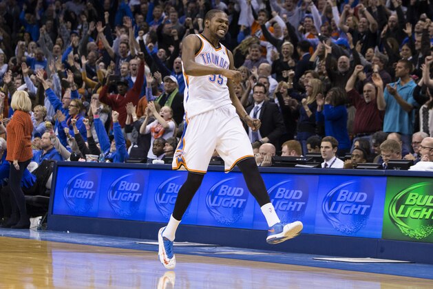 OKLAHOMA CITY, OK - JANUARY 27, 2014:  Kevin Durant #35 of the Oklahoma City Thunder celebrates after hitting a game winning shot against the Atlanta Hawks at the Chesapeake Arena on January 27, 2014 in Oklahoma City, Oklahoma. NOTE TO USER:  User expressly acknowledges and agrees that, by downloading and/or using this photograph, user is consenting to the terms and conditions of the Getty Images License Agreement. Mandatory Copyright Notice:  Copyright 2014 NBAE (Photo by Richard Rowe/NBAE via Getty Images)