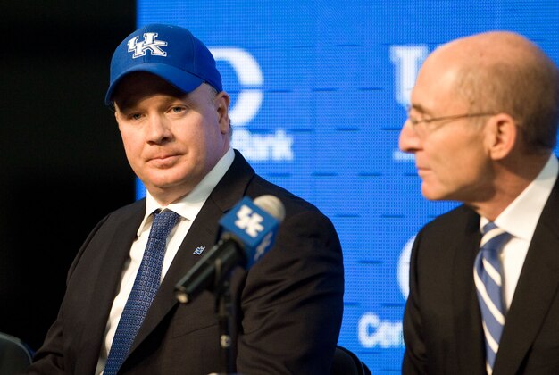 Dec 2, 2012; Lexington , KY, USA; Kentucky Wildcats head coach Mark Stoops spoke to reporters with University of Kentucky president  Dr. Eli Capilouto (right) after being introduced as the new football coach at the University of Kentucky in the Nutter Field House. Mandatory Credit: Mark Zerof-USA Today Sports