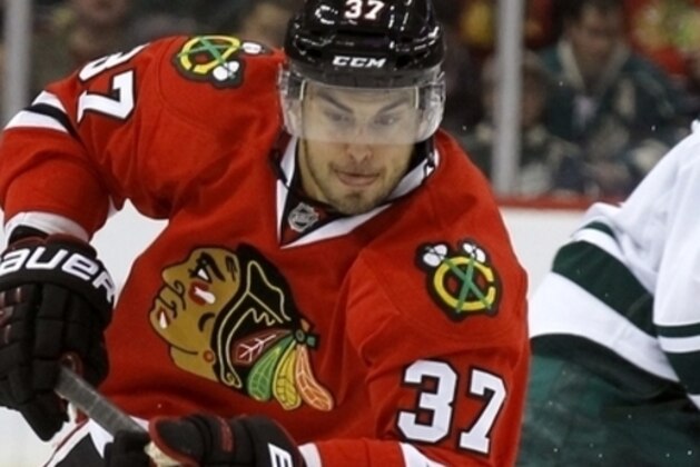 Chicago Blackhawks center Brandon Pirri (37) controls the puck during the second period of an NHL hockey game against the Minnesota Wild in St. Paul , Minn., Monday, Oct. 28, 2013. (AP Photo/Ann Heisenfelt)