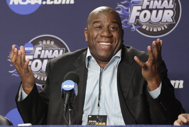 FILE - This April 6, 2009 file photo shows former Lakers star Magic Johnson during a news conference before the championship game between Michigan State and North Carolina at the men's NCAA Final Four college basketball tournament, in Detroit. A group that includes Johnson and longtime baseball executive Stan Kasten agreed Tuesday night, March 27, 2012,  to buy the Los Angeles Dodgers from Frank McCourt for a record $2 billion. (AP Photo/Amy Sancetta, File)