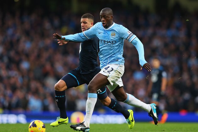 MANCHESTER, ENGLAND - NOVEMBER 24: Yaya Toure of Manchester City breaks past Kyle Walker of Tottenham Hotspur on the way to setting up Sergio Aguero for their team's fourth goal during the Barclays Premier League match between Manchester City and Tottenham Hotspur at Etihad Stadium on November 24, 2013 in Manchester, England. (Photo by Alex Livesey/Getty Images) MANCHESTER, ENGLAND - NOVEMBER 24: Yaya Toure of Manchester City breaks past Kyle Walker of Tottenham Hotspur on the way to setting up Sergio Aguero for their team's fourth goal during the Barclays Premier League match between Manchester City and Tottenham Hotspur at Etihad Stadium on November 24, 2013 in Manchester, England. (Photo by Alex Livesey/Getty Images)