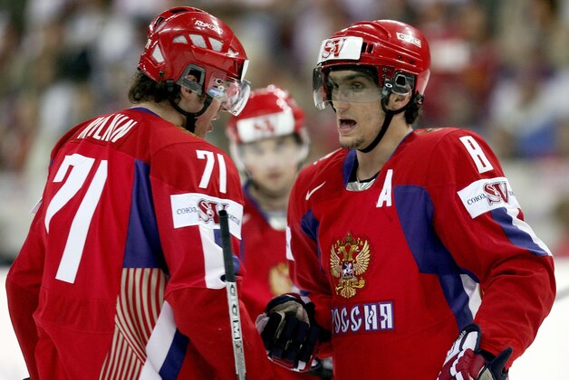 RIGA, LATVIA - MAY 18:  Evgeni Malkin #71 and Alexander Ovechkin #8 of Russia converse in the first period of the IIHF World Championship quarterfinal game between Russia and the Czech Republic at Riga Arena on May 18, 2006 in Riga, Latvia.  (Photo by Jeff Gross/Getty Images)